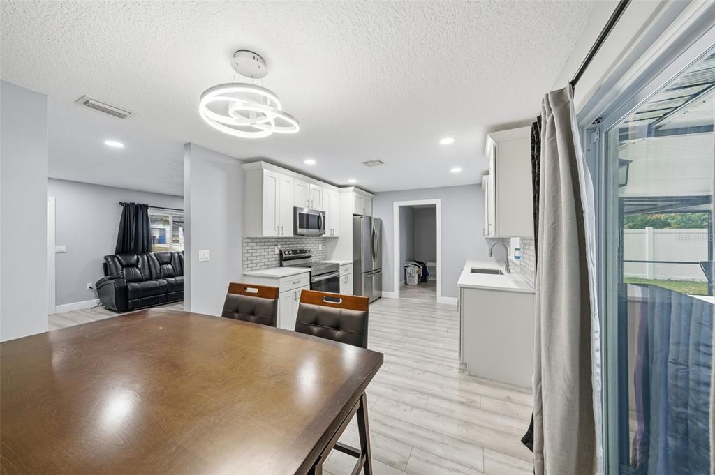 1113 Oakhill Street Seffner, FL 33584 - Photo 20 of 44 a kitchen with stainless steel appliances a refrigerator and a stove top oven