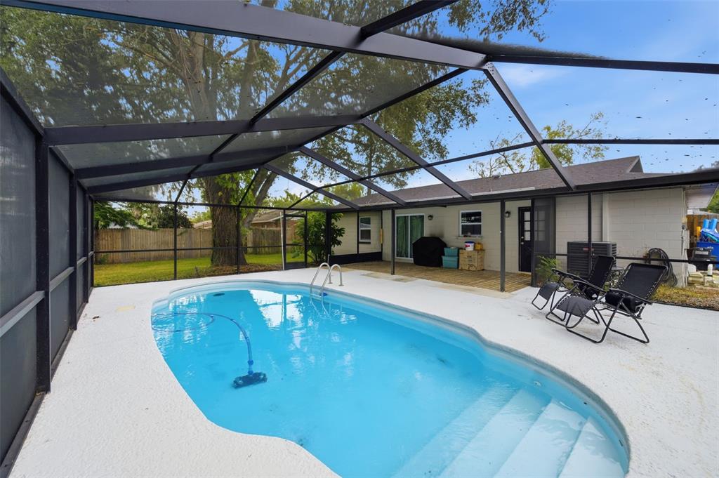1113 Oakhill Street Seffner, FL 33584 - Photo 33 of 44 a view of a swimming pool with a patio