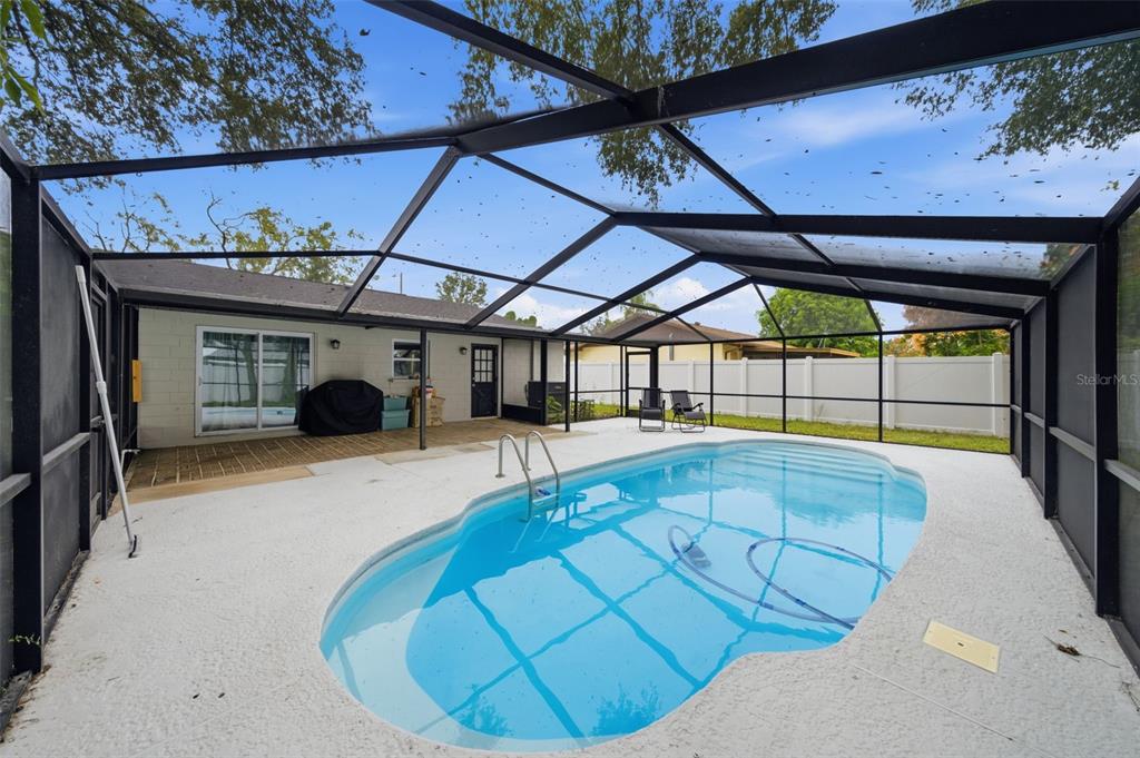1113 Oakhill Street Seffner, FL 33584 - Photo 41 of 44 a view of a swimming pool with a porch