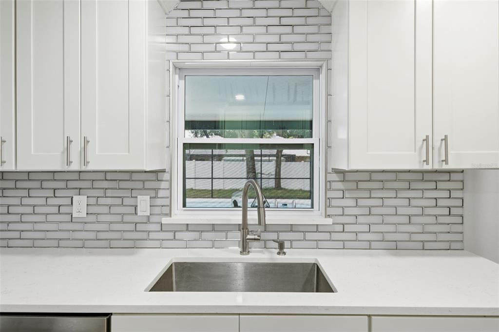 1113 Oakhill Street Seffner, FL 33584 - Photo 8 of 44 a kitchen with a sink and a stove