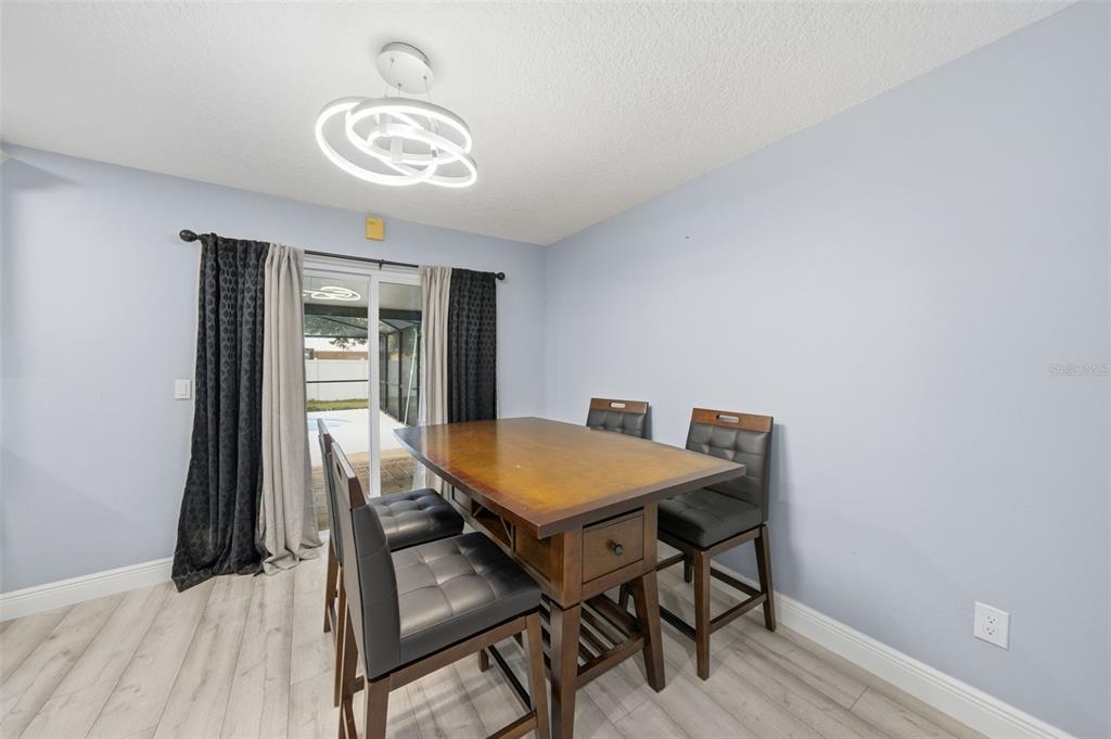 1113 Oakhill Street Seffner, FL 33584 - Photo 9 of 44 a view of a room that has a table and chairs in it