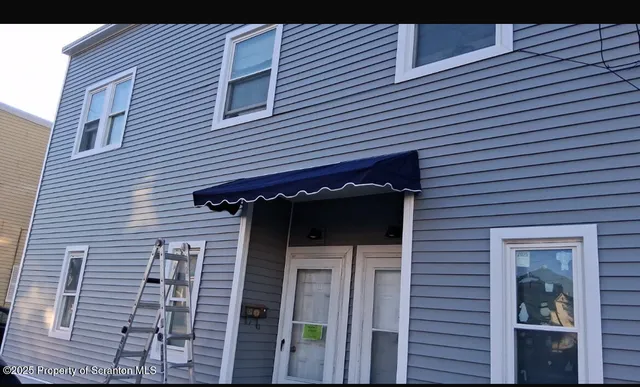 a view of a kitchen with a sink