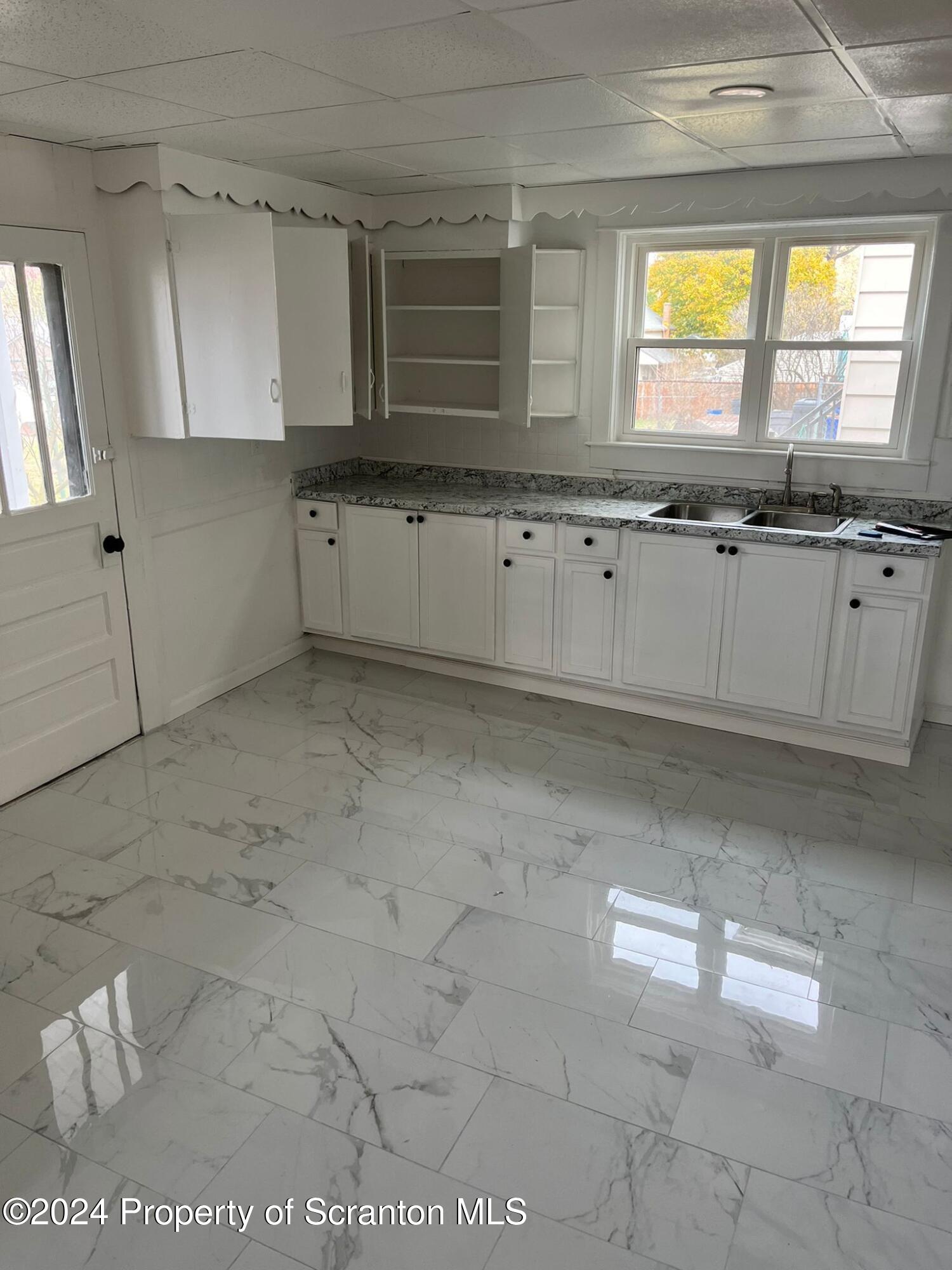 258 Main Street, Unit 3(REAR) Dupont, PA 18641 - Photo 2 of 10 a view of a kitchen with a sink