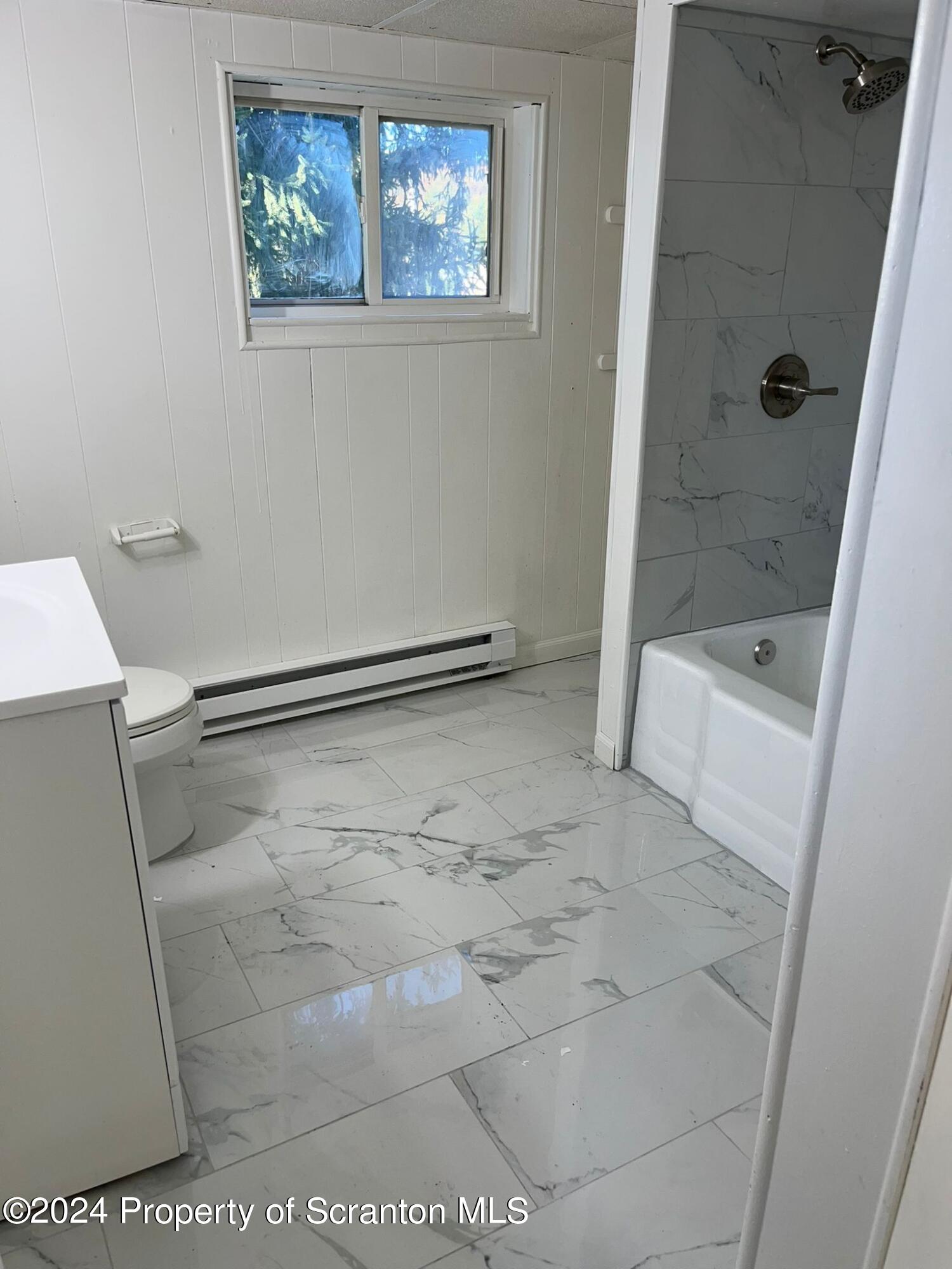 258 Main Street, Unit 3(REAR) Dupont, PA 18641 - Photo 5 of 10 a bathroom with a glass door shower