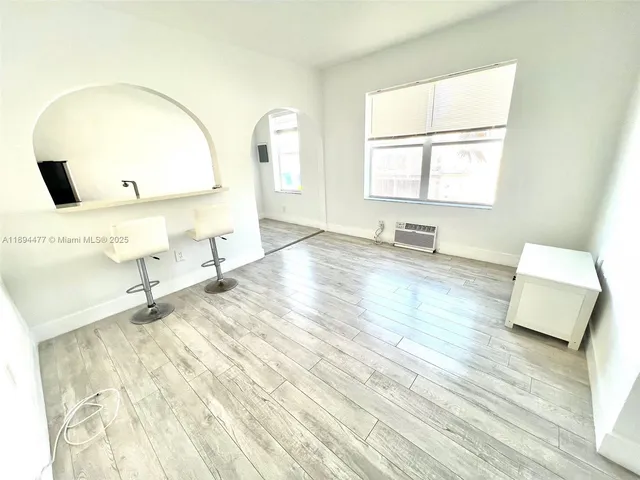 a bathroom with a sink mirror and window
