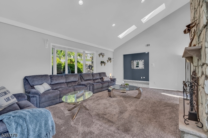 11 Bass Rock Road Hopatcong, NJ 07843 - Photo 12 of 50 a living room with furniture and a flat screen tv
