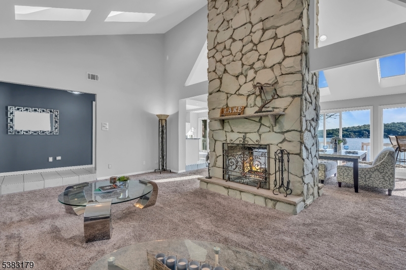 11 Bass Rock Road Hopatcong, NJ 07843 - Photo 13 of 50 a living room with furniture and a fireplace