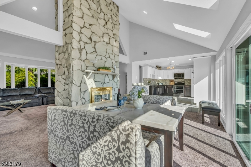 11 Bass Rock Road Hopatcong, NJ 07843 - Photo 15 of 50 a living room with furniture and a fireplace