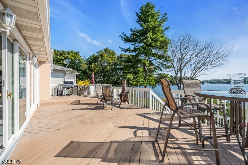 11 Bass Rock Road Hopatcong, NJ 07843 - Photo 31 of 50 a view of a patio with a table and chairs and potted plants