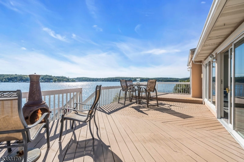 11 Bass Rock Road Hopatcong, NJ 07843 - Photo 32 of 50 a view of a balcony with chairs and wooden floor