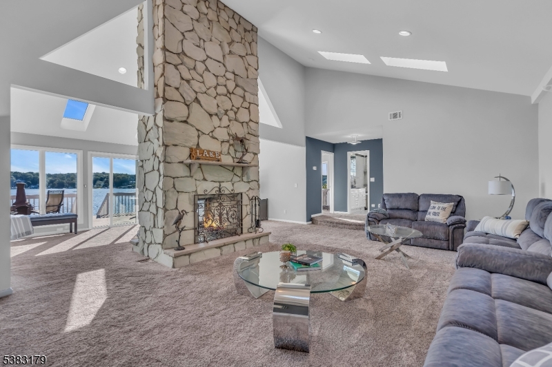 11 Bass Rock Road Hopatcong, NJ 07843 - Photo 10 of 50 a living room with furniture and outdoor seating