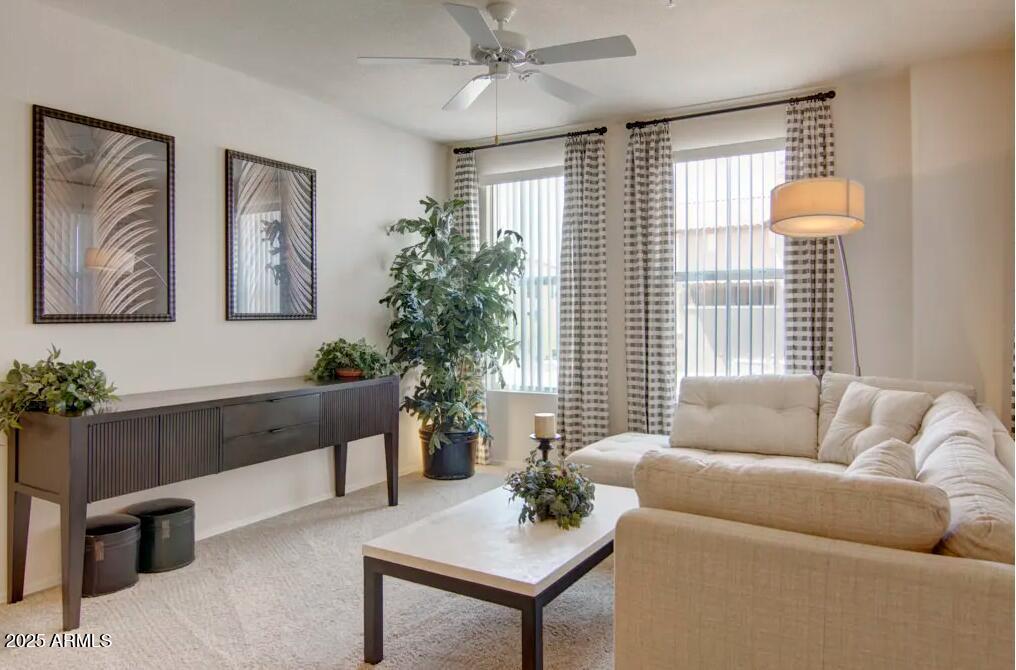 3825 West Anthem Way, Unit B1 Anthem, AZ 85086 - Photo 2 of 10 a living room with furniture and a large window