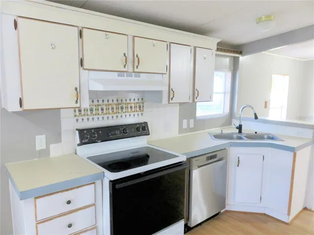 a view of cabinets with wooden floor