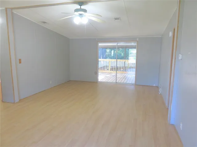a view of an empty room and window