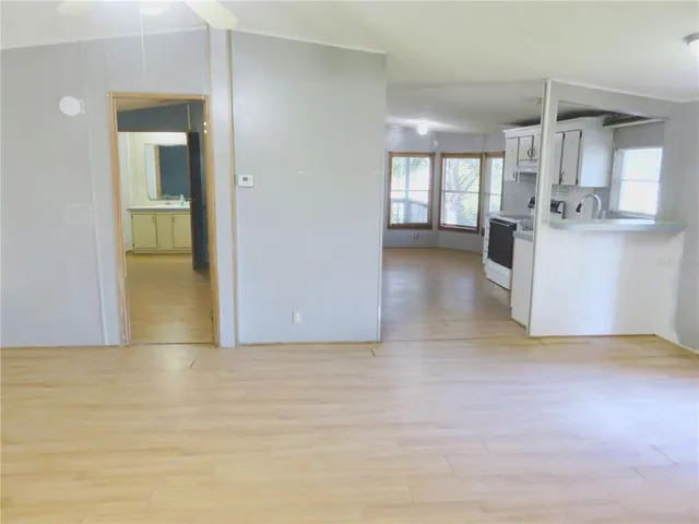 a white toilet sitting next to a bath tub