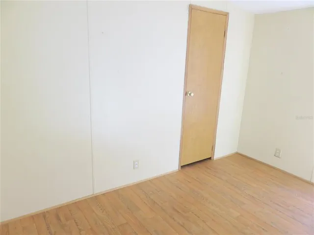 a view of a small space with wooden floor