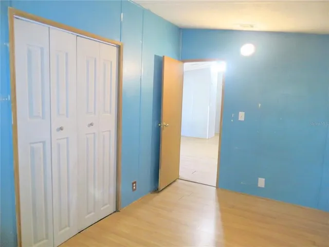 a room with a window and a fan