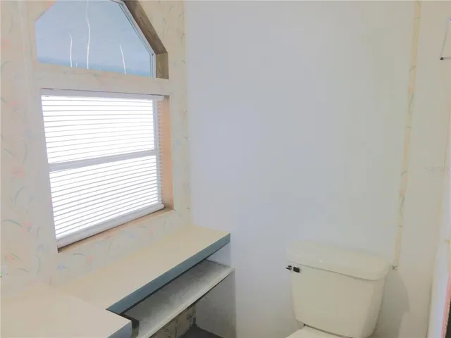 a bathroom with a tub and sink