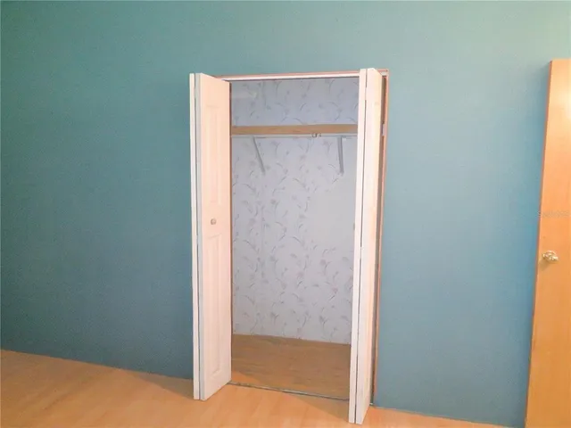 a view of balcony with wooden floor