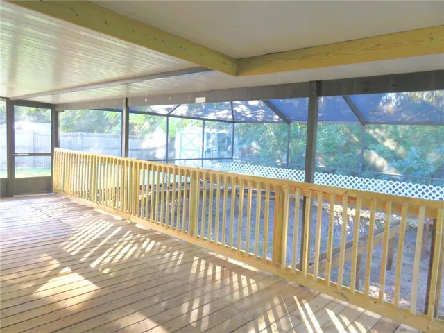 a view of balcony with wooden floor