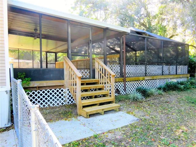 a view of a deck with a yard