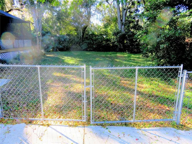 a view of backyard with green space