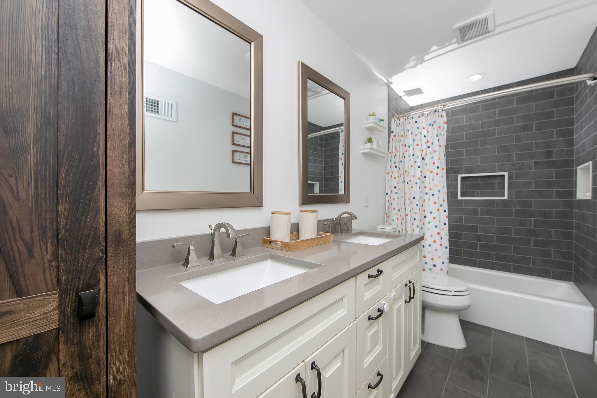 121 Capella Road Sewell, NJ 08080 - Photo 17 of 29 a bathroom with a sink and a mirror