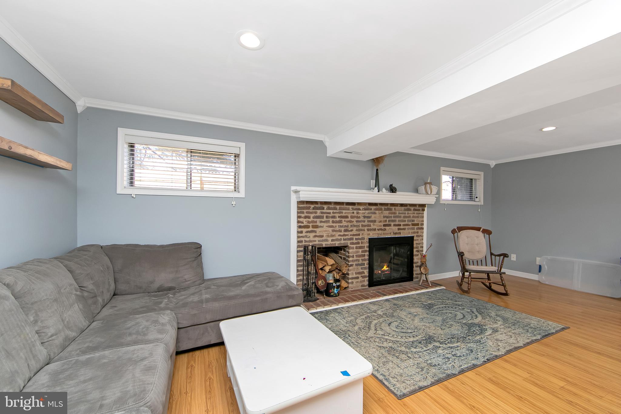 121 Capella Road Sewell, NJ 08080 - Photo 19 of 29 a living room with furniture and a fireplace
