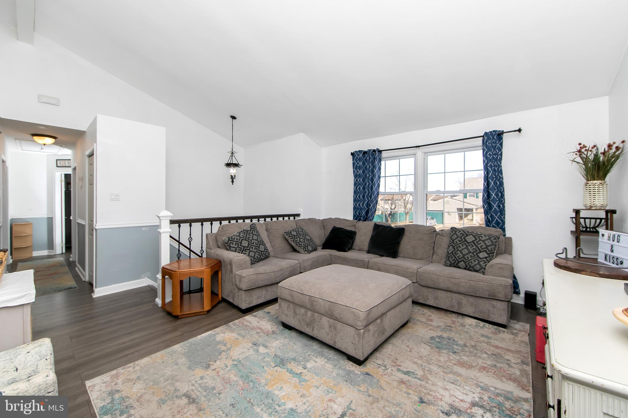 121 Capella Road Sewell, NJ 08080 - Photo 4 of 29 a living room with furniture and wooden floor