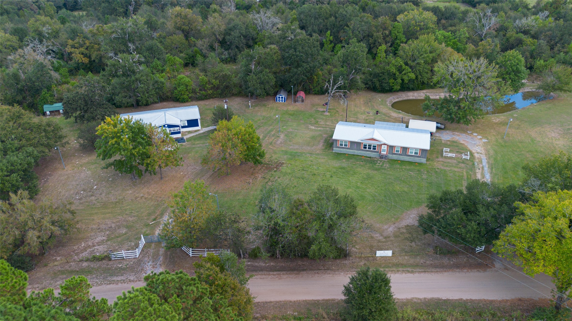 an aerial view of a house with outdoor space