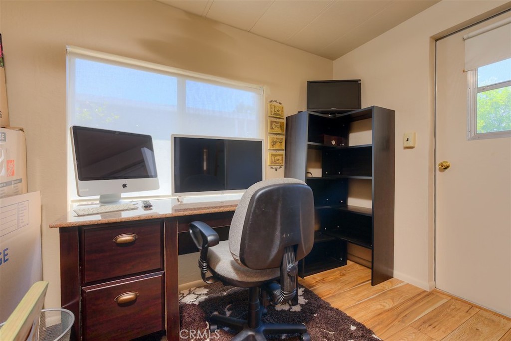 1901 Dayton Road, Unit 133 Chico, CA 95928 - Photo 23 of 36 a view of a workspace with furniture and mirror