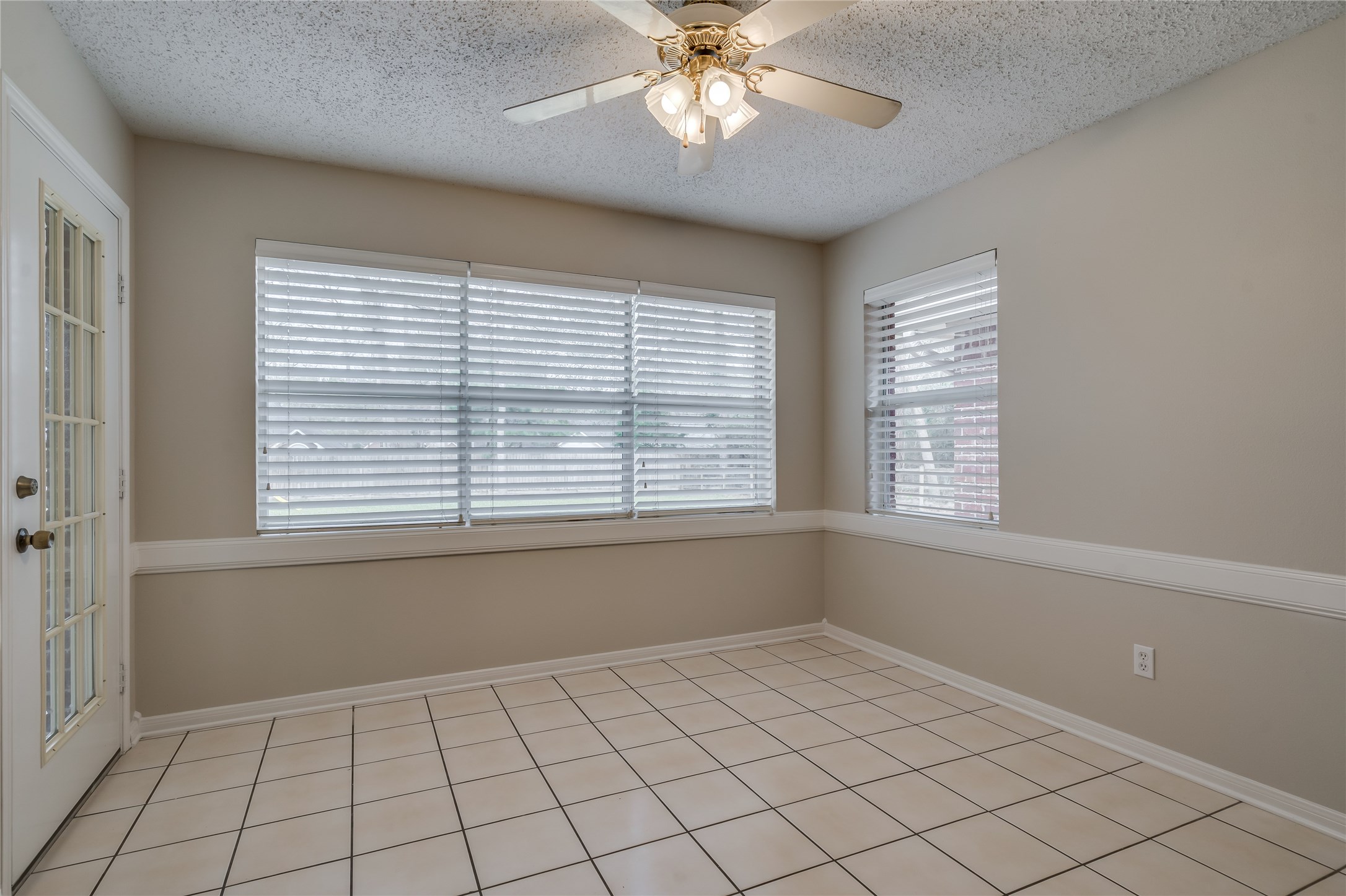 2460 Pebblebrook Circle Conroe, TX 77384 - Photo 14 of 27 Breakfast room and backdoor to the covered patio