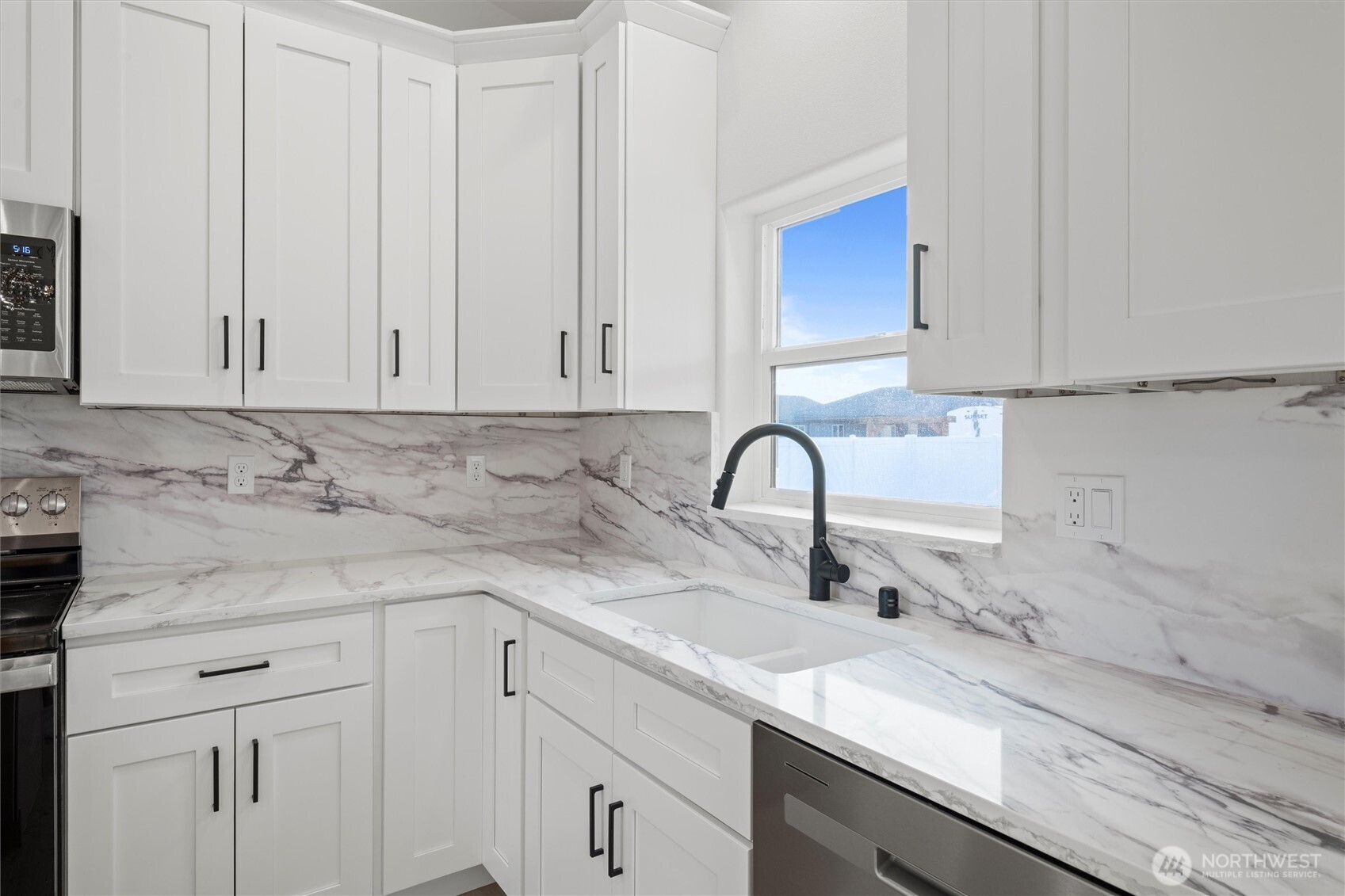 2391 Hunters Street Ephrata, WA 98823 - Photo 15 of 40 a view of a kitchen with white cabinets