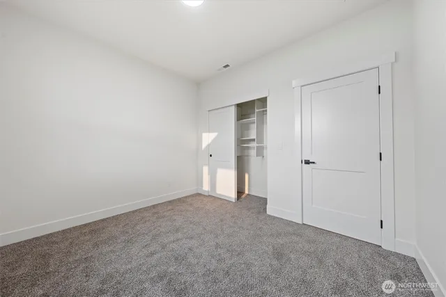 a bathroom with a granite countertop sink vanity and mirror