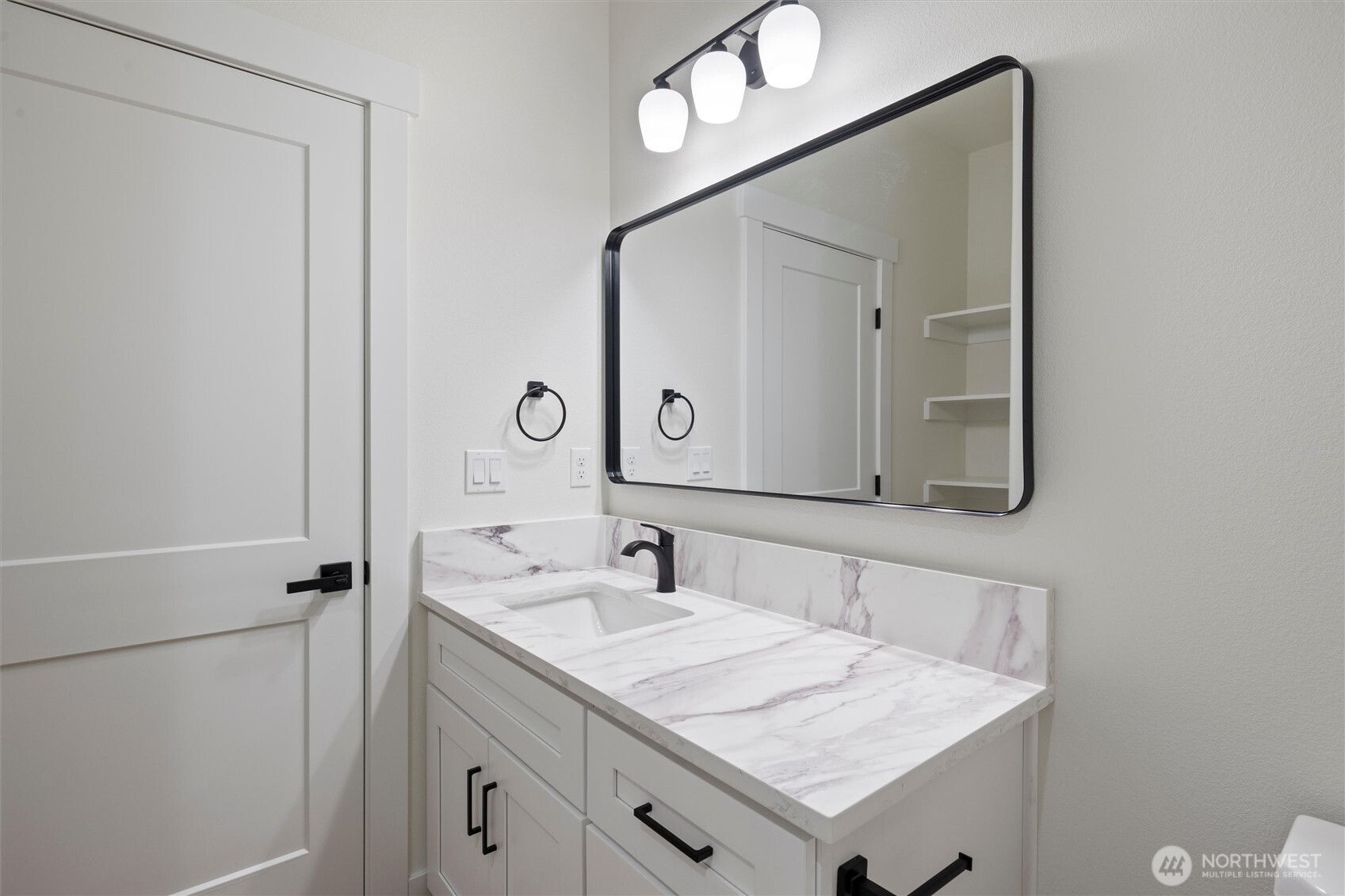 2391 Hunters Street Ephrata, WA 98823 - Photo 24 of 40 a bathroom with a sink vanity and a mirror