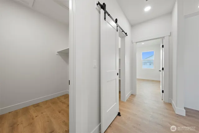 a view of an empty room with a kitchen