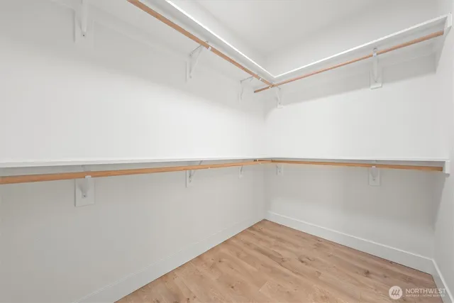 a bathroom with a double vanity sink and mirror