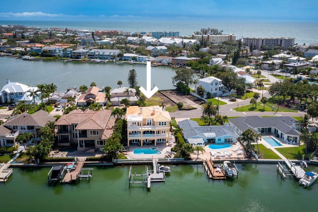 a aerial view of a house with a ocean view