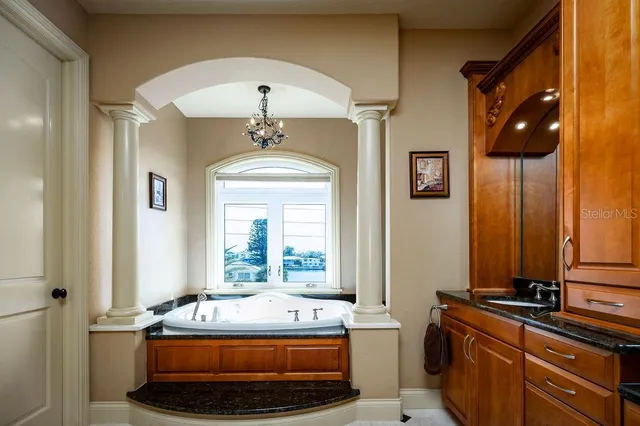 a living room with a bed furniture and a window