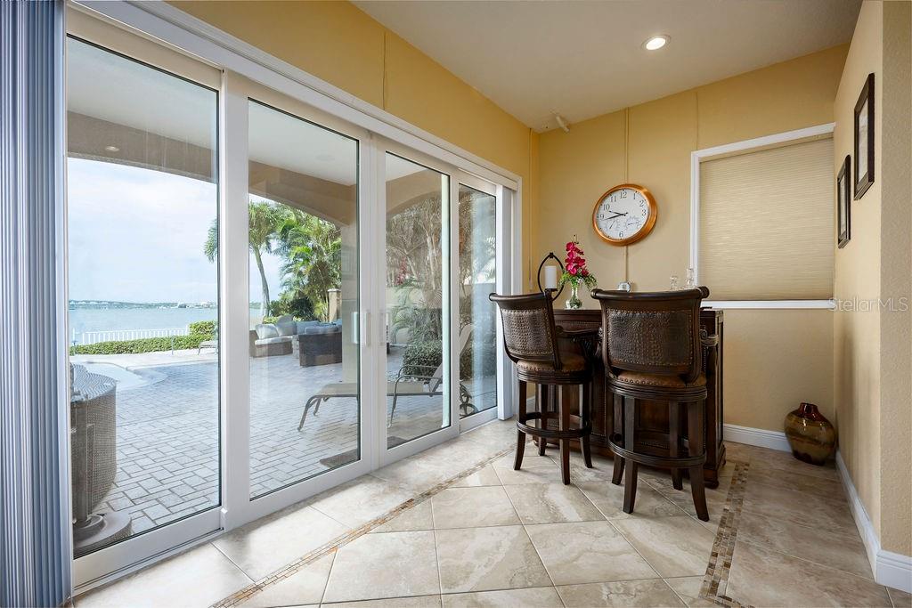 306 Harbor Drive Indian Rocks Beach, FL 33785 - Photo 35 of 49 a view of a dining room and hall with furniture