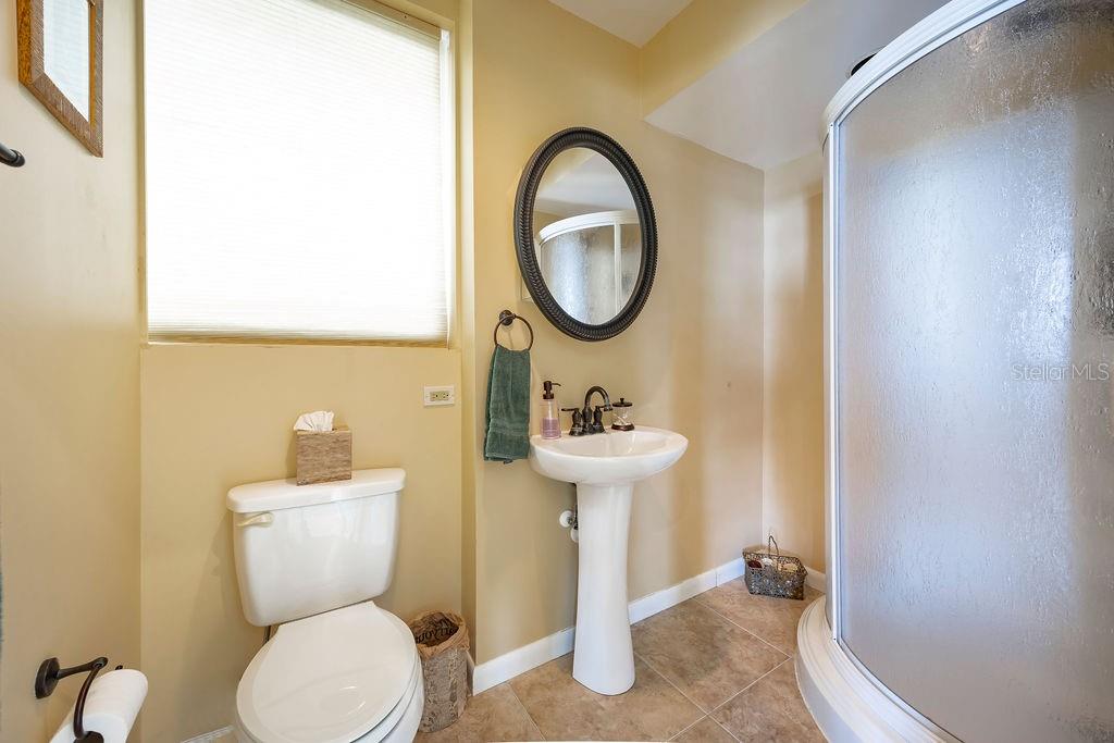 306 Harbor Drive Indian Rocks Beach, FL 33785 - Photo 36 of 49 a bathroom with a sink and a mirror