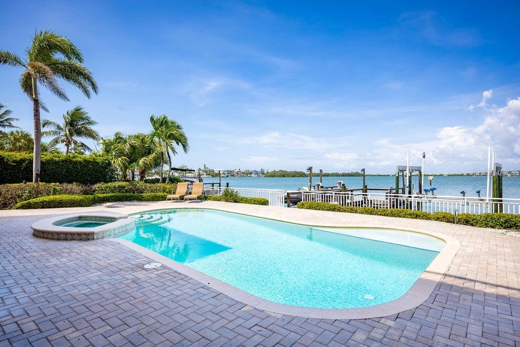 306 Harbor Drive Indian Rocks Beach, FL 33785 - Photo 39 of 49 a view of a swimming pool with a patio