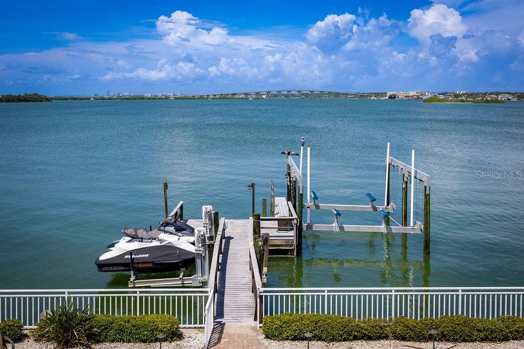 306 Harbor Drive Indian Rocks Beach, FL 33785 - Photo 44 of 49 a view of a balcony with two chairs