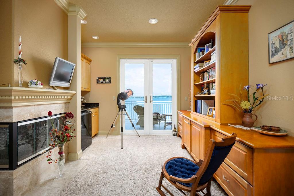 306 Harbor Drive Indian Rocks Beach, FL 33785 - Photo 7 of 49 a living room with furniture a flat screen tv and a window