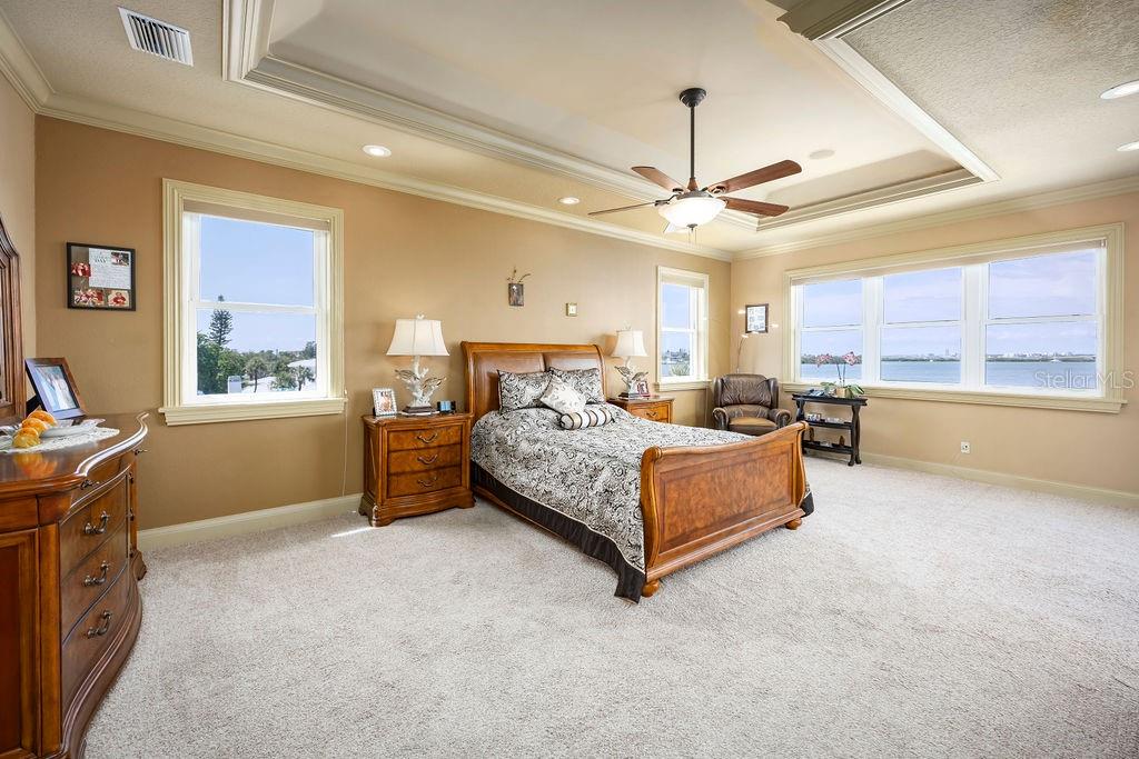 306 Harbor Drive Indian Rocks Beach, FL 33785 - Photo 8 of 49 a bedroom with a bed dresser and a window