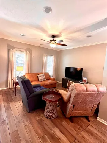 a bedroom with a bed and a television