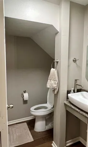 a bathroom with a sink toilet and a vanity