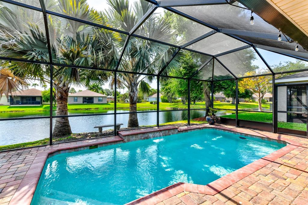 THE HEATED POOL IS THE HEART OF THIS LOVELY HOME.