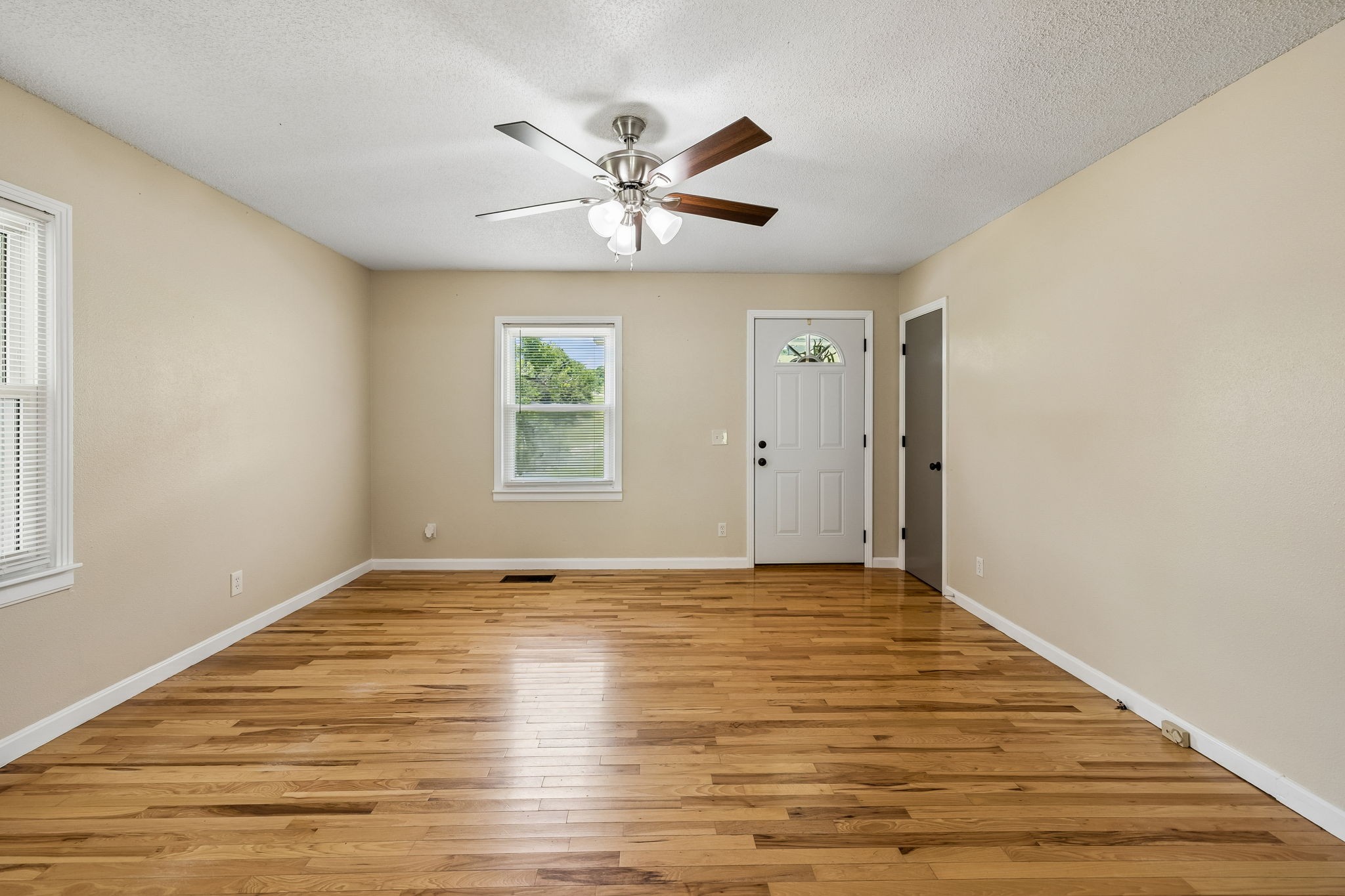 14 Morris Lane Carthage, TN 37030 - Photo 14 of 31 a view of an empty room with window and wooden floor