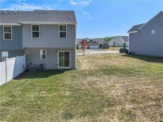 a view of a backyard of the house